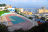 Oran, Algeria / Algrie: oval track surrounding a handball field - view over the harbour, Quai Ste. Thrse - photo by M.Torres | piste ovale entourant un terrain de handball - vue sur le port