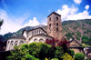 Andorra la Vella: St Esteve Church / Esglsia de St. Esteve - tower and three Romanesque apses and a medieval belfry altered by architect Josep Puig i Cadafalch in 1940 - photo by M.Torres