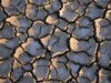 Azerbaijan - Gobustan / Qobustan / Kobustan: cracked dry mud - mud volcano area - photo by Austin Kilroy