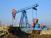 Baku - Azerbaijan: nodding donkey pumpjack near the harbour, below Bibi Heybat Mosque - photo by F.MacLachlan