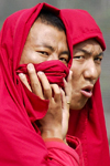 Bhutan, Thimphu: Monks watching archery contest - photo by J.Pemberton