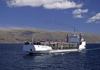 Lake Titicaca, Manco Kapac Province, La Paz Department, Bolivia: the Manco Capac is the largest freight liner on the lake - seen here carrying train cars - photo by C.Lovell