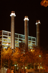 Barcelona, Catalonia: 'La Canadenca' chimneys and modern faade at night - photo by T.Marshall