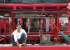 China - Hainan Island: smoking break on a boat (photo by G.Friedman)