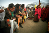 Xiahe county, Gannan Tibetan Autonomous Prefecture, Gansu province, China: pilgrims worshipping - monks procession - photo by Y.Xu