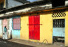 Moroni, Grande Comore / Ngazidja, Comoros islands: colourful faade and man wearing a kanzu white robe - photo by M.Torres