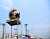 Goma, Nord-Kivu, Democratic Republic of the Congo: roundabout - empty police podium with soccer ball - Anciens de Don Bosco - pylon and cables - photo by M.Torres