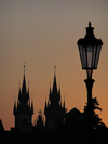 Prague, Czech Republic: Charles bridge at dawn - silhouette of the Church of Our Lady Before Tyn - photo by J.Kaman