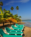 Ro San Juan, Mara Trinidad Snchez province, Dominican republic: beach chairs and young coconut trees - photo by M.Torres