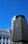 Quito, Ecuador: black building with saucer of Banco La Filantrpica in contrast with an elegant neighbour - architect architect Diego Ponce - Avenida Pichincha and Calle General Pedro Briceo - Plaza Simn Bolvar - photo by M.Torres