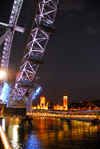 London: British Airways London Eye and the Parliament - Thames river - at night - photo by M.Torres