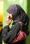 Eritrea - Asmara: Muslim girl waiting for the bus - photo by E.Petitalot