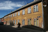 Estonia - Valga: wooden houses and cyclist - Riia street - photo by A.Dnieprowsky