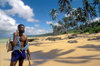 Coral Coast, Viti Levu, Fiji: fisherman, coconut palms, white sand beach, and tropical palacio waters of the Coral Coast - photo by C.Lovell