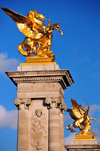 Paris, France: Pont Alexandre III - towers at the south end of the bridge, counterweight socles, topped with bronze equestrian groups symbolizing Pegasus held by Fame, foreground Fame of Combat / Commerce, background fame of Industry / War - left bank - Quai d'Orsay - photo by M.Torres