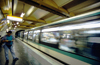 Paris, France: man on metro platform - blurred train in motion, Champs-lysesClemenceau station - 8e arrondissement - photo by K.Gapys