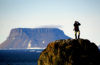 20 Franz Josef Land: Armed guard on lookout rock, Flora Island - photo by B.Cain