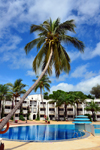 Banjul, The Gambia: pool side view of the Laico Atlantic hotel, with a coconut tree leaning over the pool - photo by M.Torres