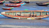 Barra, The Gambia: low tide - traditional wooden fishing boats on the beach - north bank of the River Gambia - photo by M.Torres