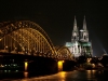 Germany / Deutschland - Cologne / Kln / CGN (North Rhine-Westphalia): rail bridge over the Rhine and the Cathedral - nocturnal - Der Dom (photo by G.Friedman)