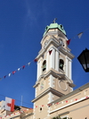 Gibraltar: Cathedral of Saint Mary the Crowned bell tower, bunting and flag of Gibraltar, Main Street - Roman Catholic Diocese of Gibraltar - photo by M.Torres