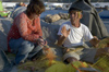 Greece, Dodecanese, Leros:local fishermen mending his nets at Pandeli harbour - photo by P.Hellander