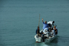 Rubane Island, Bijags Archipelago - UNESCO biosphere reserve, Bubaque sector, Bolama region, Guinea Bissau / Guin Bissau: Hotel Punta Anchaca - boat leaving with a tourist and staff / Hotel Punta Anchaca, barco de pesca, touristas, empregados - photo by R.V.Lopes