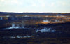 Hawaii island, Kilauea volcano: steam rises from hot vents on the caldera floor in the early morning - frozen lava flow - photo by R.Eime