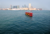 Hong Kong: ferry and Kowloon skyline seen from the Central Ferry Piers - photo by M.Torres