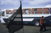 Iran - Kerman: bus terminal - the black flag of the Shia - photo by W.Allgower