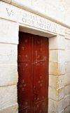 Jerusalem, Israel: Via Dolorosa, 5th station, door of the Franciscan  church dedicated to Simon the Cyrenian, who took  Jesus' cross, and carried it for him - photo by M.Torres