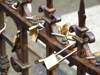 Florence / Firenze - Tuscany, Italy: Italian Love padlocks on the railing of the statue of Benvenuto Cellini - Ponte Vecchio - photo by M.Bergsma