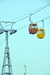 Erbil / Hewler, Kurdistan, Iraq: Shanadar Park - cable car, the Erbil Teleferique - tower and two cabins against blue sky - photo by M.Torres