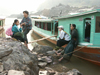 Laos - Pakbeng: the river boat from from Chang Kong in Thailand - passengers wait - long tail ferry - photo by P.Artus