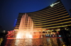 Macau, China: Wynn Macau luxury hotel and casino resort - dancing fountain at night - Cidade de Sintra Street - photo by M.Torres