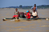 Tsimafana, Belo sur Tsiribihina,  Menabe Region, Toliara Province, Madagascar: small trimaran for public transportation - river Tsiribihina - family on a boat - photo by M.Torres