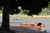 Bekopaka, Antsalova district, Melaky region, Mahajanga province, Madagascar: beach under a large tree - ferries on the Manambolo River - photo by M.Torres