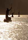 Antsalova district, Melaky region, Mahajanga province, Madagascar: Manambolo River - men in canoes - silhouettes at sunrise - photo by M.Torres