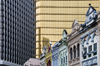 Kuala Lumpur, Malaysia: old shopfronts in front of new skyscrapers - photo by J.Pemberton