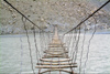 Pakistan - Passu - Upper Hunza / Gojal region - Northern Areas: rickety suspension bridge over the Khunjrab river - photo by A.Summers