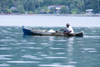 man on a cayuco - Isla Grande, Coln, Panama, Central America - photo by H.Olarte