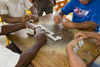 Anton, Cocle province, Panama: four men playing dominoes - table view - photo by H.Olarte