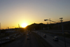 Panama City: sunset and traffic - Panama Canal's Amador Causeway - photo by H.Olarte