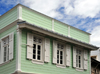 Saint-Denis, Runion: green faade - creole architecture on Rue de Nice - photo by M.Torres