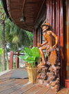 Bom Bom islet / Ilhu Bom-Bom, Prncipe island, So Tom and Prncipe / STP: Bom Bom Island Resort - wooden sculpture outside the restaurant - latitude zero / escultura de madeira na varanda do restaurante - sobre o equador - photo by G.Frysinger