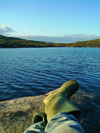 South Uist island / Uibhist a Deas, Outer Hebrides, Scotland: Loch Snigisclett - boots and water - photo by T.Trenchard