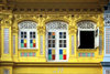 Singapore - Shop House - decorated yellow faade - vernacular architectur - photo by S.Lovegrove