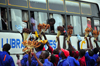 Mukono, Uganda: at the long distance bus stop vendors struggle to sell food to the passengers through the windows - photo by M.Torres