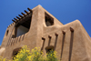 Santa F, New Mexico, USA: New Mexico Museum of Art, former Museum of Fine Arts - 1 PM shadows - rounded adobe construction with dark wood details - Pueblo architecture - photo by A.Ferrari