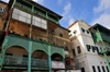 Stone Town, Zanzibar, Tanzania: faades with wooden balconies along Mizingani Road - Seaview Indian Restaurant - photo by M.Torres